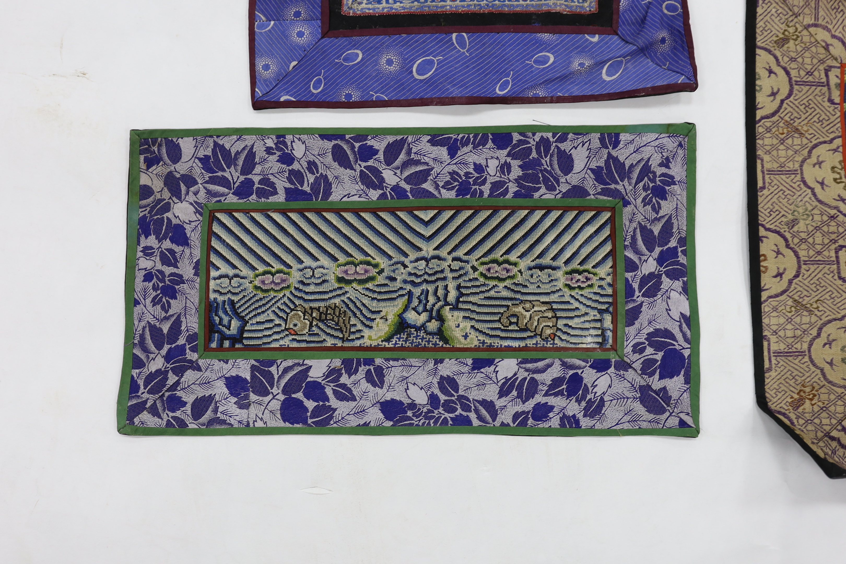 A Kesi Chinese woven panel, a Beijing knot mat, two other embroidered panels, a circular mat together with two sets of six circular mats with gold thread embroidery of animals